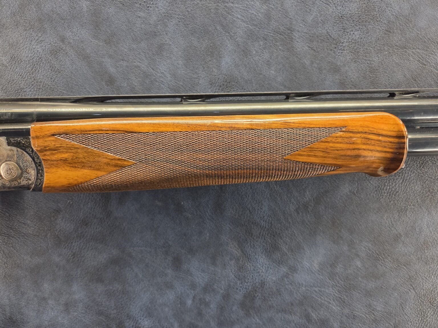 Checkered walnut forend and barrels of the Caesar Guerini Magnus Sporting Limited